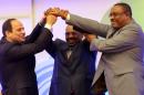 Egyptian President Abdel-Fattah al-Sisi (L), Sudanese President Omar al-Bashir (C) and Ethiopian PM Hailemariam Desalegn shake hands during a meeting in Khartoum on March 23, 2015, on Ethiopia's Grand Renaissance dam project