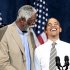 President Barack Obama, right, smiles as he is introduced by NBA basketball hall-of-famer, Bill Russell, left, during a Democratic fundraiser at the Paramount Theater, Sunday, Sept., 25, 2011, in Seattle. (AP Photo/Pablo Martinez Monsivais)