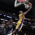 Los Angeles Lakers center Andrew Bynum, right, scores past the Charlotte Bobcats center DeSagana Diop during the first half of an NBA basketball game in Los Angeles, Tuesday, Jan. 31, 2012. (AP Photo/Chris Carlson)