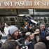 Five-Star Movement activist and comedian Grillo talks to media as he leaves the shareholders meeting at Banca Monte dei Paschi in Siena