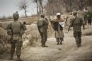 U.S. troops stop a man to search him while on patrol near Command Outpost AJK (short for Azim-Jan-Kariz, a near-by village) in Maiwand District, Kandahar Province, Afghanistan