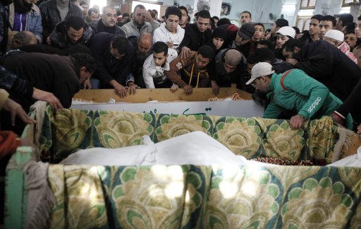 Mourners carry the bodies of victims of Wednesday's soccer violence at Port Said stadium during their funeral in Port Said