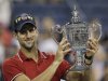 Novak Djokovic of Serbia poses with the trophy after winning the men's championship match against Rafael Nadal of Spain at the U.S. Open tennis tournament in New York, Monday, Sept. 12, 2011. (AP Photo/Matt Slocum)