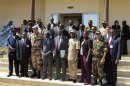 Mali's Defence Minister Camara poses with military experts and officials taking part in a meeting to discuss the Mali crisis in Bamako