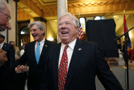 FILE - In this April 3, 2013, file photo, former Gov. Haley Barbour, right, and current Gov. Phil Bryant laugh prior to the unveiling of his portrait by artist Greg Cartmell of Meridian, Miss., at the Capitol in Jackson, Miss. From county chairmen to national party luminaries, veteran Republicans across the country are accusing tea party lawmakers of staining the GOP with their refusal to bend in the budget impasse in Washington. Barbour is just as pointed, saying this about the tea party-fueled refusal to support spending measures that include money for Obama’s health care law: "It never had a chance." (AP Photo/Rogelio V. Solis, File)