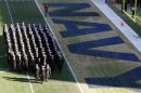 Midshipmen from the United States Naval Academy march during formation before the start of the Army versus Navy football game in Philadelphia, Pennsylvania