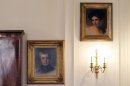 In this March 13, 2012 photo, a portrait of Maria Gratz, top right, hangs next to a portrait of her husband, Benjamin Gratz, in the Rosenbach Museum & Library in Philadelphia. The portrait of Maria Gratz by Thomas Sully joins nine others of the Gratz family at the museum. (AP Photo/Alex Brandon)