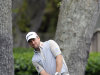 Graeme McDowell, of Northern Ireland, chips onto the second green during the final round of the RBC Heritage golf tournament in Hilton Head Island, S.C., Sunday, April 21, 2013. (AP Photo/Stephen Morton)