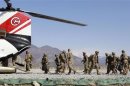 U.S. Army soldiers board a helicopter as they leave after the end of one year deployment at Forward Operating Base Joyce in Kunar province
