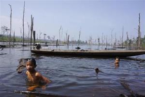 Children swim in an artificial reservoir created for&nbsp;&hellip;