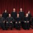 In this photo taken Oct. 8, 2010, the U.S. Supreme Court justices pose for a group photo at the Supreme Court in Washington. Three justices will turn 80 before the next presidential term ends: Associate Justices Ruth Bader Ginsburg, right, who leads the closely divided court's liberal wing, Antonin Scalia, second from left, a conservative, and Anthony Kennedy, second from right, who leans conservative, but on some issues provides a decisive vote for the liberals. A titanic confirmation fight would ensue if it allowed a Republican president to cement conservative control of the court, or a Democrat president to give liberal appointees a working majority for the first time in decades. Others seated are Associate Justice Clarence Thomas, left, and Chief Justice John Roberts, center; standing from left are Associate Justices Sonia Sotomayor, Stephen Breyer,  Samuel Alito Jr., and Elena Kagan. (AP Photo/Pablo Martinez Monsivais)
