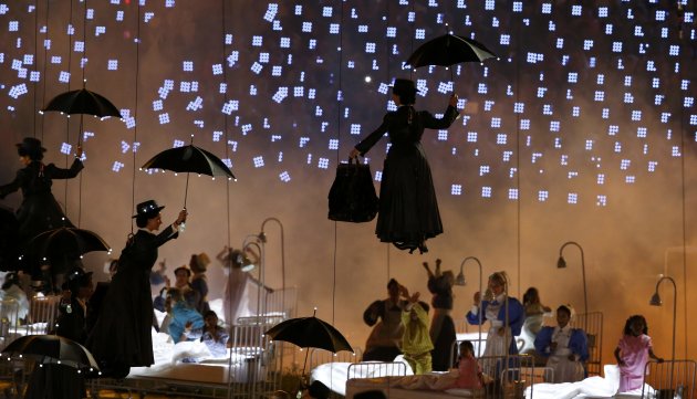 Performers take part in the opening ceremony of the London 2012 Olympic Games at the Olympic Stadium