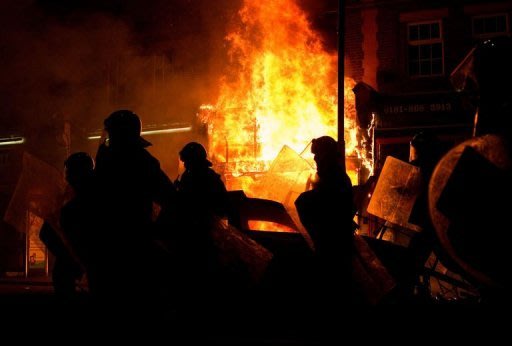A shop burns on a main road in Tottenham