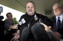 FILE - In this Feb. 22, 2012 file photo, Kim Dotcom, the founder of the file-sharing website Megaupload, comments after he was granted bail and released in Auckland, New Zealand. In the eyes of New Zealand immigration authorities in 2010, Kim Dotcom's money trumped his criminal past. Documents released to The Associated Press this week under New Zealand public records laws show that immigration officials granted the Megaupload founder residency that year after deciding the money he could bring to the country outweighed concern about criminal convictions in his native Germany for computer fraud and stock-price manipulation. (AP Photo/New Zealand Herald, Brett Phibbs, File) NEW ZEALAND OUT, AUSTRALIA OUT