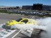 Driver Matt Kenseth burns out after winning the NASCAR Sprint Cup Series auto race on Sunday, March 10, 2013, in Las Vegas. (AP Photo/Isaac Brekken)
