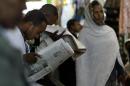People read a newspaper on May 14, 2005 in Addis Ababa, Ethiopia