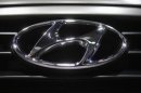 A Hyundai logo is seen on a car at the Paris Mondial de l'Automobile