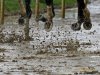 Horses run around a muddy track during the ninth race before the 139th Kentucky Derby at Churchill Downs Saturday, May 4, 2013, in Louisville, Ky. (AP Photo/J. David Ake)