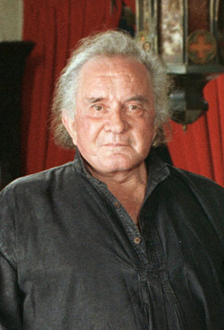 FILE - In a 1999 file photo, the late country music legend Johnny Cash poses at his Hendersonville, Tenn. home. Kenny Chesney, Kris Kristofferson, Lucinda Williams, Ray LaMontagne and Jamey Johnson are among the performers scheduled to appear in ?We Walk the Line: A Celebration of the Music of Johnny Cash? on April 20 at the Austin City Limits Live venue in Austin, Texas. (AP Photo/Mark Humphrey, file)