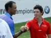 Tiger Woods, left, and Rory McIlroy of Northern Ireland, shake after the first round of the BMW Championship PGA golf tournament at Crooked Stick Golf Club in Carmel, Ind., Thursday, Sept. 6, 2012. (AP Photo/Charles Rex Arbogast)