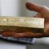 Gold dealer Stan Morton holds a block of gold valued at $63,000 in Los Angeles