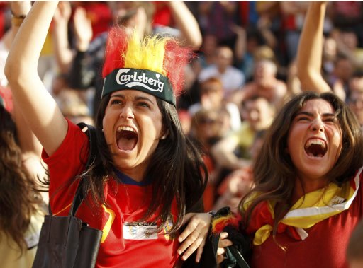 Spanish fans celebrate an equalizing goal scored by their team during their first match of the Euro 2012 against Italy at the fan zone in Gdansk