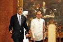 U.S. President Obama walks with President Aquino of the Philippines at the Malacanang Palace in Manila