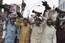 In this Tuesday, April 17, 2012 photo, Pakistani journalists chant slogans during a demonstation in Quetta, Pakistan. The telephone call to local journalists generally comes in the late evening. The voice on the other end is usually a Sunni militant with a statement he wants printed threatening of violence or claiming responsibility for attacks that already occurred. Journalists fear being killed if they don't print the messages. (AP Photo/Arshad Butt)