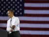 President Barack Obama rolls up his sleeves as he speaks at a campaign fundraiser at the University of Vermont in Burlington, Vt., Friday, March, 30, 2012. (AP Photo/Pablo Martinez Monsivais)