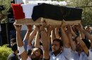 The coffin of a Christian Syrian killed in Maalula is carried during a funeral march in Damascus on September 10, 2013