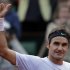 Switzerland's Roger Federer thumbs up after defeating France's Gille Simon in their fourth round match of the French Open tennis tournament at the Roland Garros stadium Sunday, June 2, 2013 in Paris. (AP Photo/Petr David Josek)