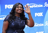 Candice Glover arrives at the "American Idol" finale at the Nokia Theatre at L.A. Live on Thursday, May 16, 2013, in Los Angeles. (Photo by Chris Pizzello/Invision/AP)