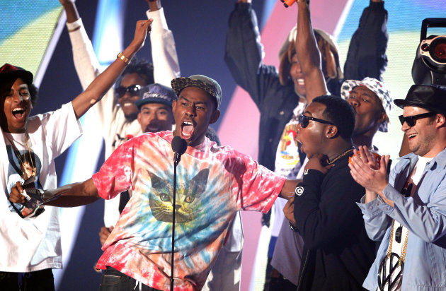 RE-TRANS FOR IMPROVED TONING - Tyler the Creator, center, presents the best hip hop video award at the MTV Video Music Awards on Sunday Aug. 28, 2011, in Los Angeles. (AP Photo/Matt Sayles)