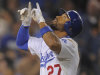 Los Angeles Dodgers' Matt Kemp points to the sky after hitting a three-run home run during the fifth inning of a baseball game against the San Francisco Giants, Wednesday, Sept. 21, 2011, in Los Angeles. (AP Photo/Mark J. Terrill)