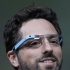 Google co-founder Sergey Brin demonstrates Google's new Glass, wearable internet glasses, at the Google I/O conference in San Francisco, Wednesday, June 27, 2012.  The audience got live video feeds from their glasses as they descended to land on the roof of the Moscone Center, the location of the conference. (AP Photo/Paul Sakuma)