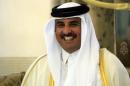 Qatar's Emir Sheikh Tamim bin Hamad al-Thani smiles as he is welcomed upon arriving at Khartoum Airport for an official visit