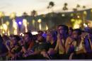 Festival goers watch Neil Young's performance on day 2 of the 2016 Desert Trip music festival at Empire Polo Field on Saturday, Oct. 8, 2016, in Indio, Calif. (Photo by Chris Pizzello/Invision/AP)
