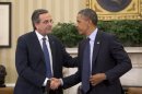 President Barack Obama shakes hands with Greek Prime Minister Antonis Samaras during their meeting in the Oval Office of the White House in Washington, Thursday, Aug. 8, 2013. The White House said the meeting will 