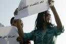 A female protester joins others protesting against sexual harassment in Cairo