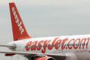 An easyJet plane stands on the tarmac at the airport in Roissy-en-France, near Paris, on June 21, 2012