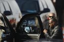 Houston's ex-husband, Brown leaves before start of the funeral service for pop singer at the New Hope Baptist Church in Newark