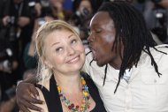 Actors Margarethe Tiesl, left and Peter Kazungu pose during a photo call for Paradise: Love at the 65th international film festival, in Cannes, southern France, Friday, May 18, 2012. (AP Photo/Joel Ryan)