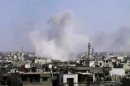 In this image made from amateur video released by the Syrian Media Council and accessed Tuesday, April 10, 2012, smoke rises following purported shelling in Homs, Syria. Syrian troops shelled and raided opposition strongholds across Syria on Tuesday, activists said, denying claims by the foreign minister that regime forces have begun pulling out of some areas in compliance with a U.N.-brokered truce. (AP Photo/Syrian Media Council via AP video) TV OUT, THE ASSOCIATED PRESS CANNOT INDEPENDENTLY VERIFY THE CONTENT, DATE, LOCATION OR AUTHENTICITY OF THIS MATERIAL