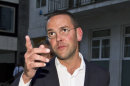 FILE - This is a Sunday July 10, 2011 photo of then Chief executive of News Corporation Europe and Asia, James Murdoch gesturing as he leaves his father Chairman of News Corporation Rupert Murdoch's residence, in central London. Britain's Sky News says media executive James Murdoch, under pressure over his role in Britain's tabloid phone hacking scandal, is stepping down as chairman of British Sky Broadcasting. Sky, the news channel of BSkyB, reports that the resignation will be confirmed later Tuesday April 3, 2012 after a board meeting. (AP Photo/Sang Tan, File)