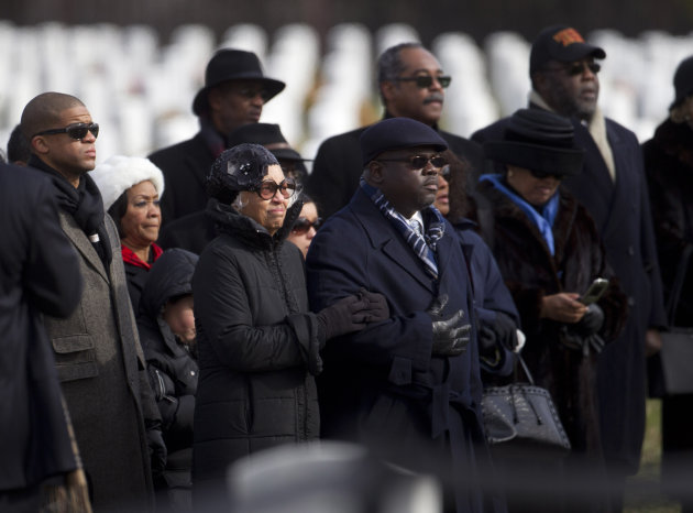 Jacqueline Weathers, widow of former Tuskegee airman retired Lt. Col. Luke Weathers, and others, watches her husband's casket arrive during burial services at Arlington National Cemetery in Arlington, Va., Friday, Jan. 20, 2012. (AP Photo/Evan Vucci)