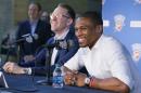 Oklahoma City Thunder guard Russell Westbrook, right, and Sam Presti, left, general manager, laugh during a news conference to announce that he has signed a contract extension with the Thunder, in Oklahoma City, Thursday, Aug. 4, 2016. (AP Photo/Sue Ogrocki)