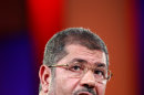 Egyptian President Mohammed Morsi speaks at the Clinton Global Initiative in New York Tuesday, Sept. 25, 2012. Morsi, the country's first democratically elected leader, says freedom of expression must be joined with responsibility in a speech that addressed the violent clashes that erupted across the Muslim world in reaction to an anti-Islam video produced in the United States. (AP Photo/David Karp)
