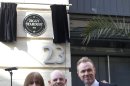 Trevor Bolder, left and Mick Woodmansey, center, members of the Spiders from Mars and Spandau Ballet band member Gary Kemp unveil a commemorative plaque to David Bowie's iconic creation, Ziggy Stardust, in Heddon Street, London, Tuesday March 27, 2012 to mark the 40th anniversary of the album 