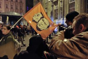 Protesters in October wave flags with portraits of&nbsp;&hellip;