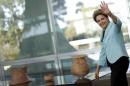 Rousseff waves during a meeting with governors at Alvorada Palace in Brasilia
